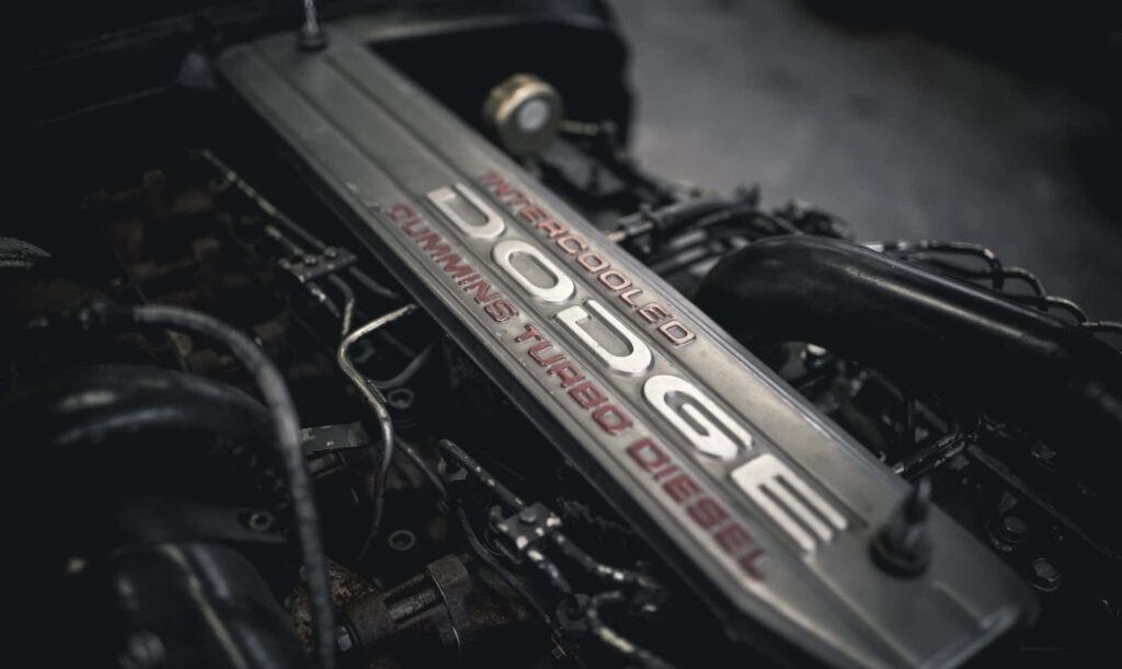 Close-up of Cummins Turbo Diesel engine in Dodge with metallic textures and detailed design Wallpaper