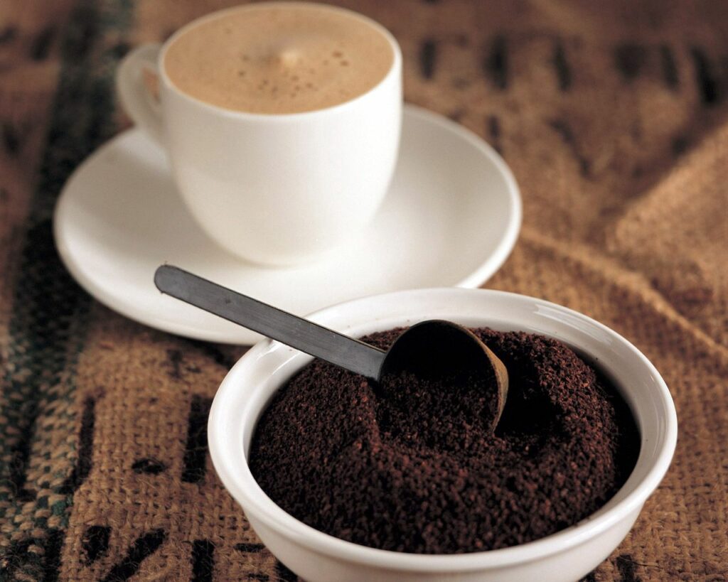 Freshly Brewed Coffee & Grounds on Rustic Burlap Wallpaper