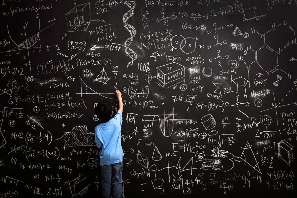Young boy in blue shirt writes complex math equations on blackboard digital art wallpaper
