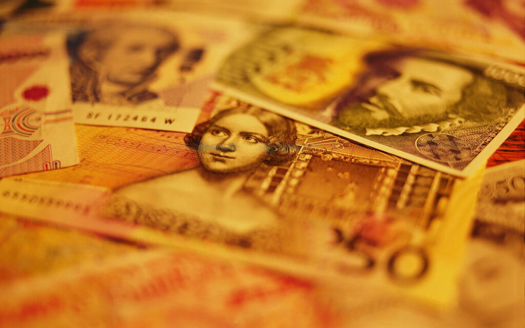 The Wealthy Tapestry: A Captivating QHD Wallpaper featuring Banknotes and Currency Concepts