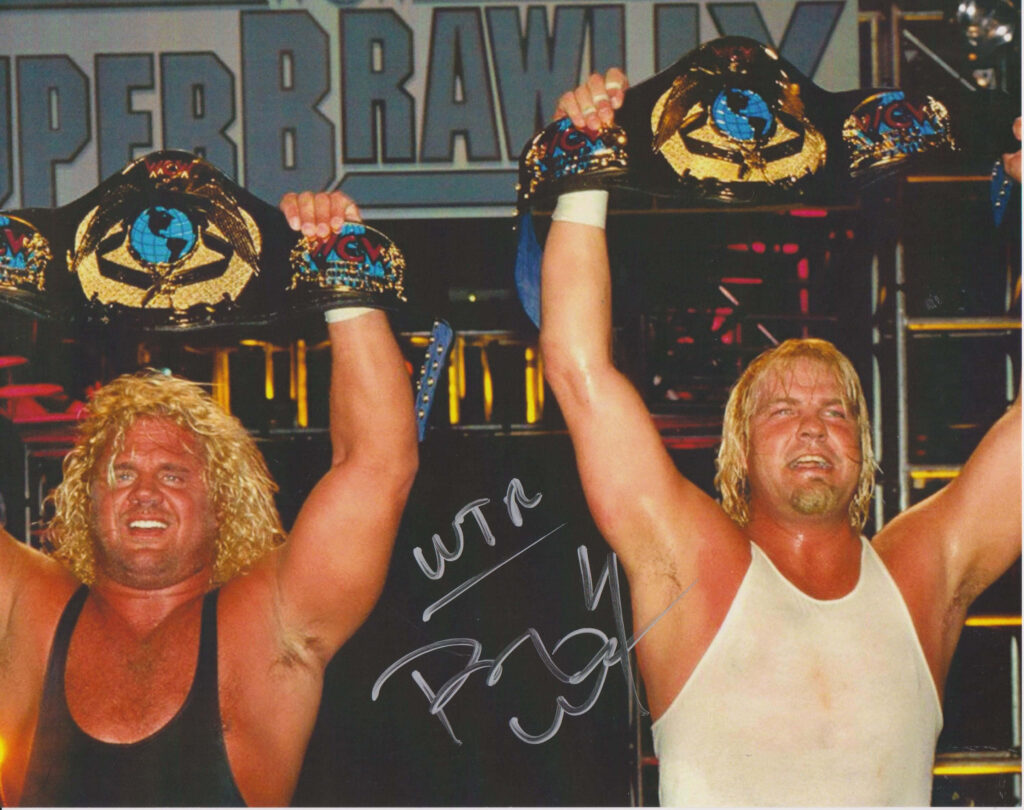 Curt Hennig and Barry Windham celebrating wrestling championship victory at SuperBrawl stage wallpaper