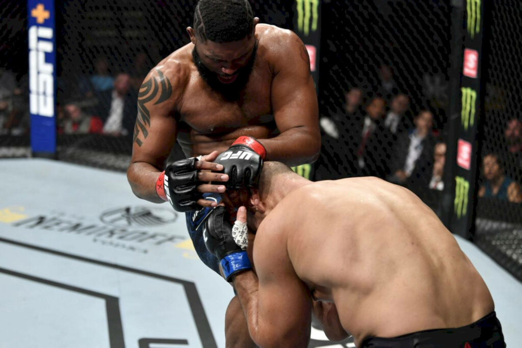 Curtis Blaydes powerful knee strike UFC octagon intense mixed martial arts action wallpaper