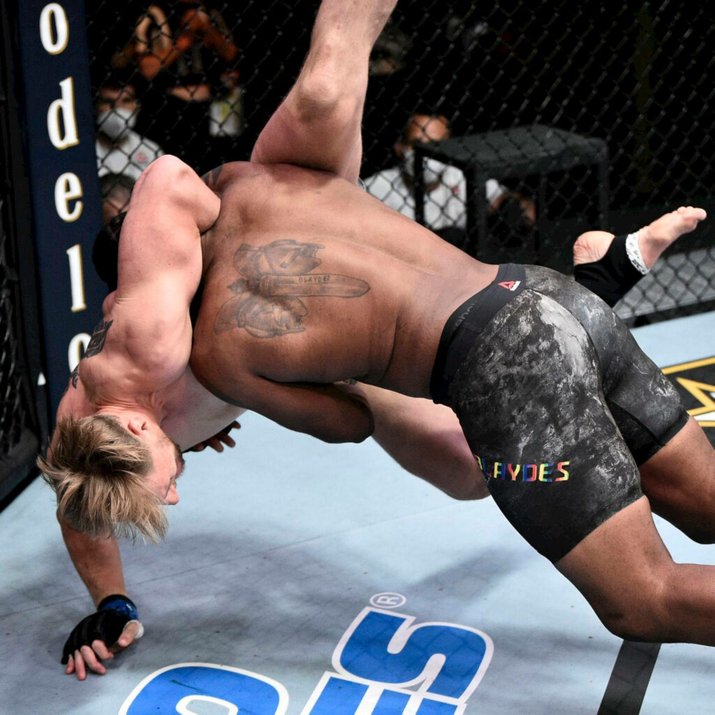 Curtis Blaydes powerful UFC slam inside octagon showcasing strength intense MMA action wallpaper