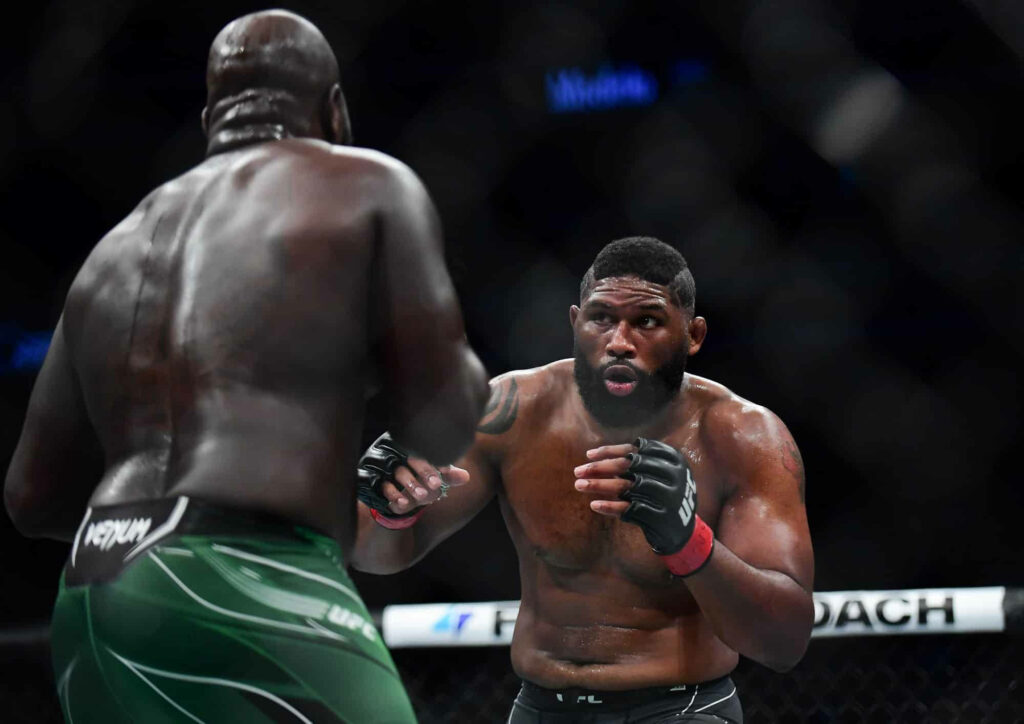 Curtis Blaydes intense UFC faceoff in octagon epic championship fight wallpaper background