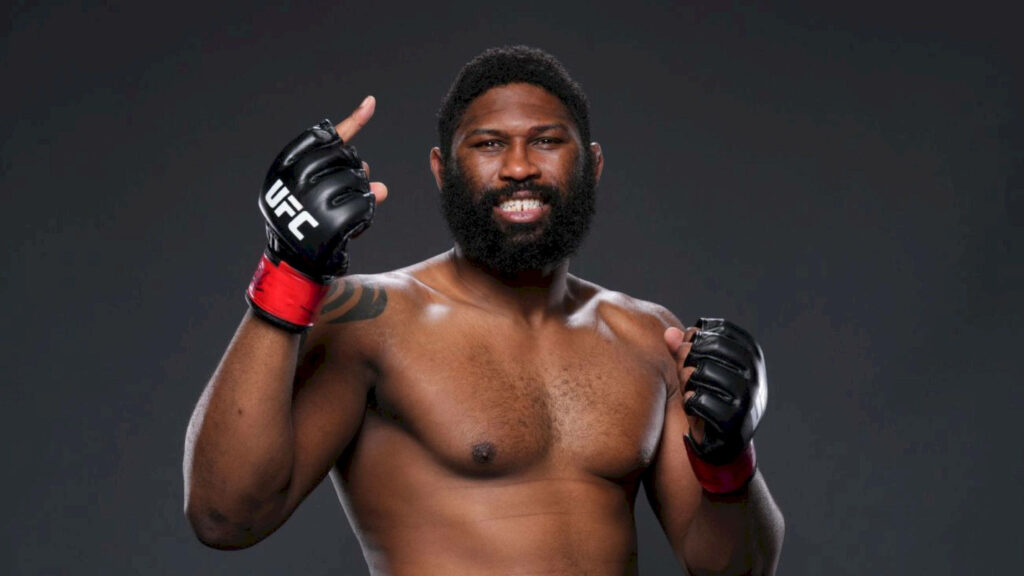 Curtis Blaydes UFC fighter in studio lighting showing strength determination and victory pose Wallpaper