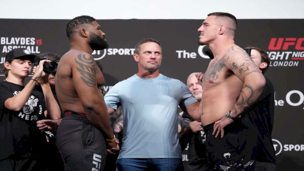 Curtis Blaydes and Tom Aspinall intense UFC weigh-in face off with focused expressions wallpaper