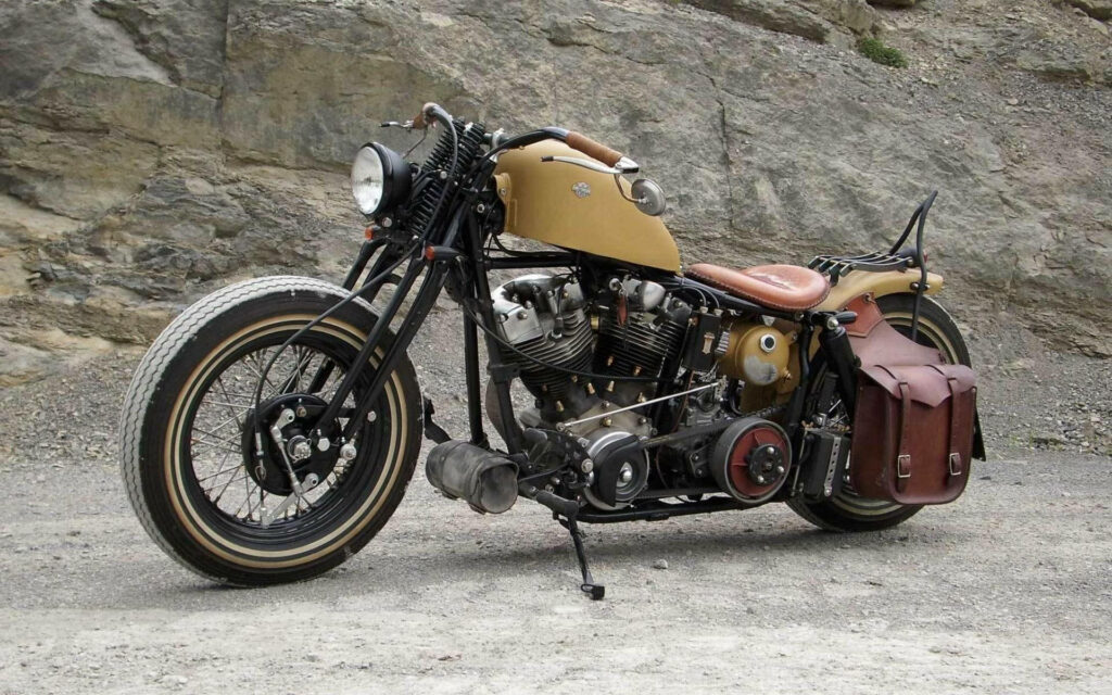 Vintage Bobber Motorcycle Wallpaper: Rugged Outdoor Charm