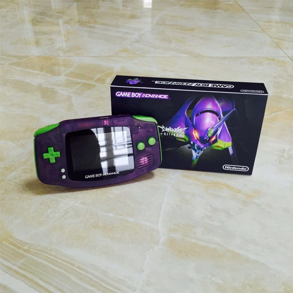 Custom translucent purple Game Boy Advance with green buttons inspired by Neon Genesis Evangelion Unit-01 beside retail box on polished floor Wallpaper