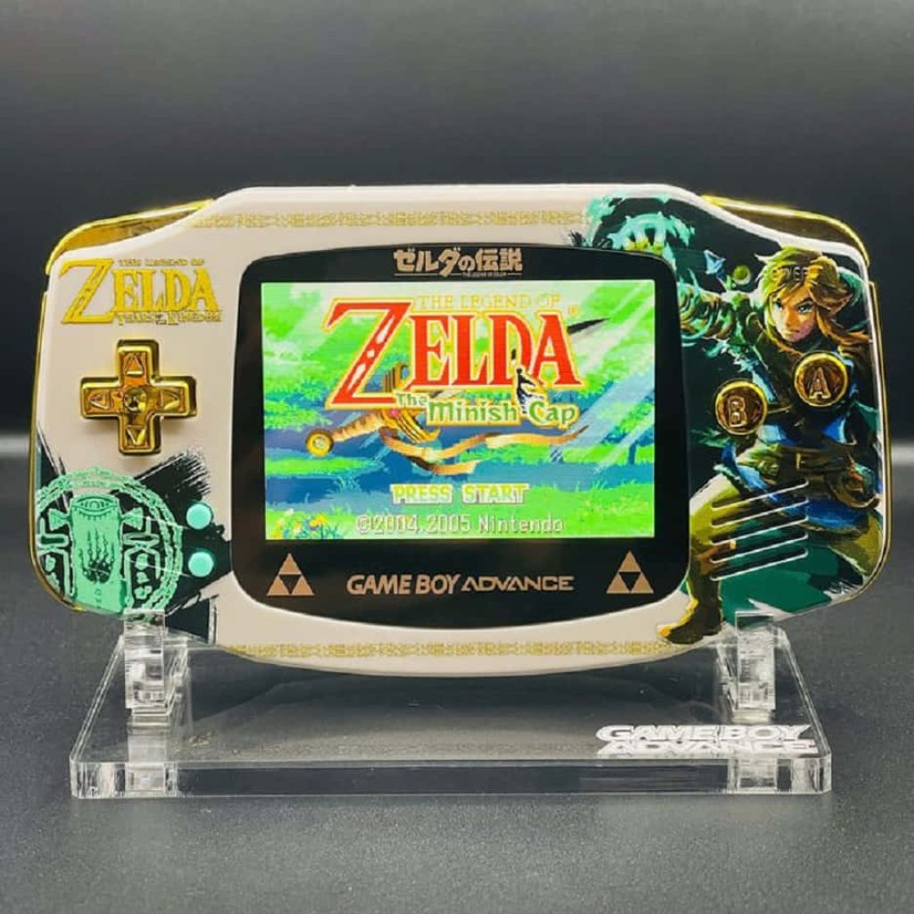 Custom Nintendo Game Boy Advance with white shell gold buttons Link artwork and Zelda Minish Cap title Wallpaper
