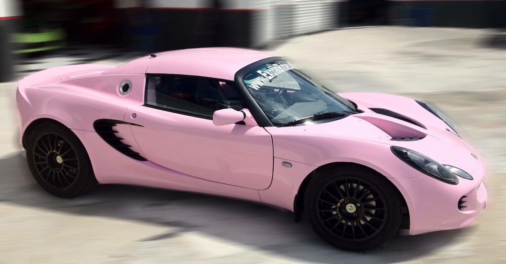 Dreamy Delight: Custom Baby Pink Lotus Elise Sports Car Wallpaper