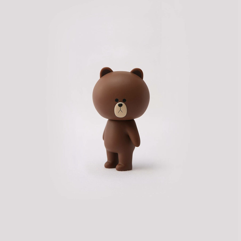 Charming Brown Bear Wallpaper on Simple White Background