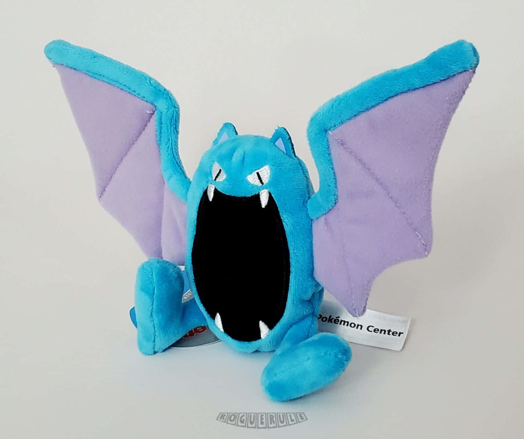 Cute Golbat plushie wallpaper with purple wings and open mouth on white background Pokemon fan