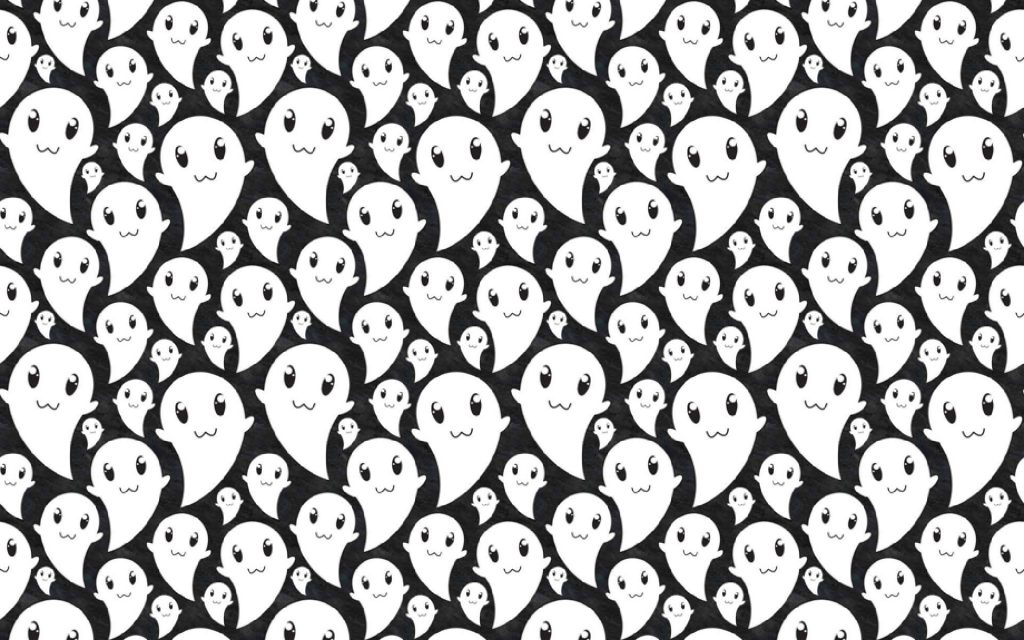 Cute Halloween wallpaper with playful white ghosts on black background for festive desktops