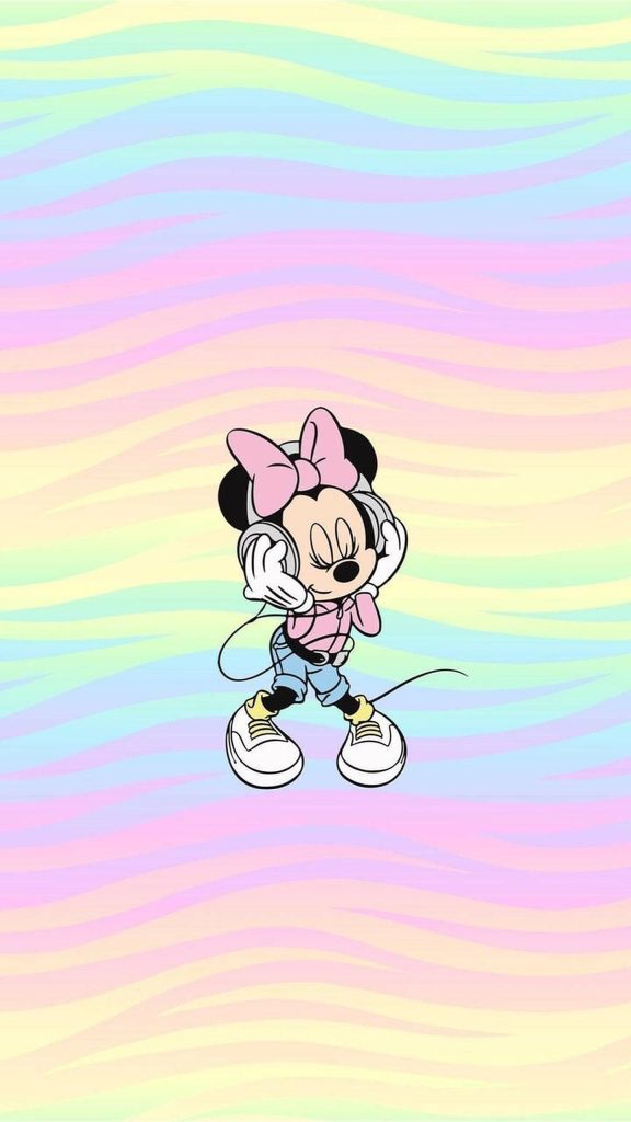 Minnie Mouse in pink jacket and white shoes listens to music on pastel rainbow background wallpaper