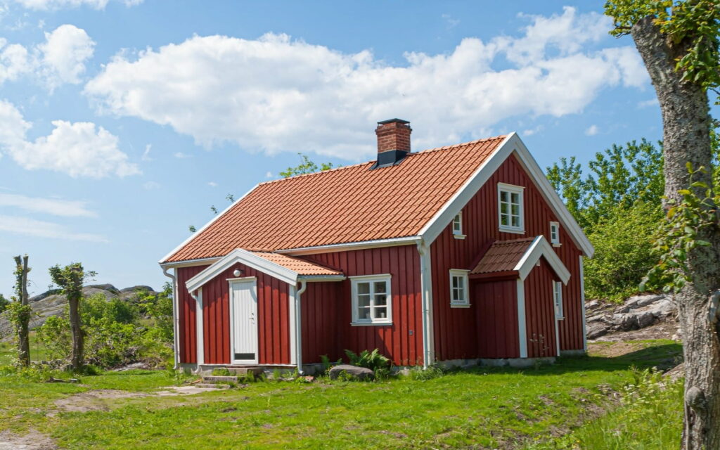The Adorable Little Red Cottage: A Captivating HD Wallpaper Background
