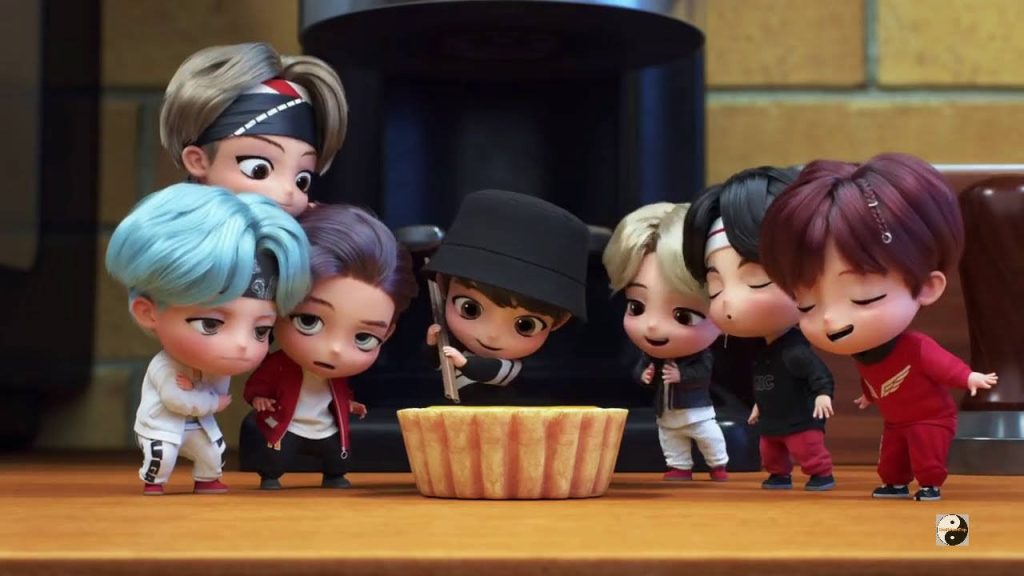 TinyTAN BTS chibi 3D characters celebrating with cake on wooden table cheerful Kpop wallpaper