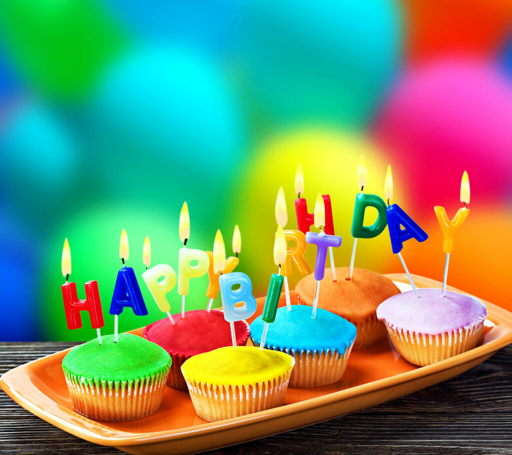 Cheerful Cupcakes on Vibrant Birthday Background Wallpaper