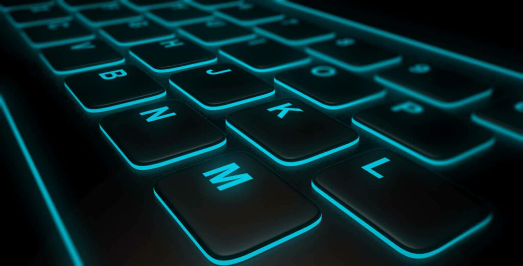 Cybernetic Serenity: Captivating Close-Up of Retro Keyboard Illuminated in Cyan Hues Against Inky Night Wallpaper