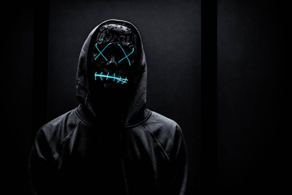 Cyberpunk Wallpaper: Mysterious Figure with Glowing Neon Mask