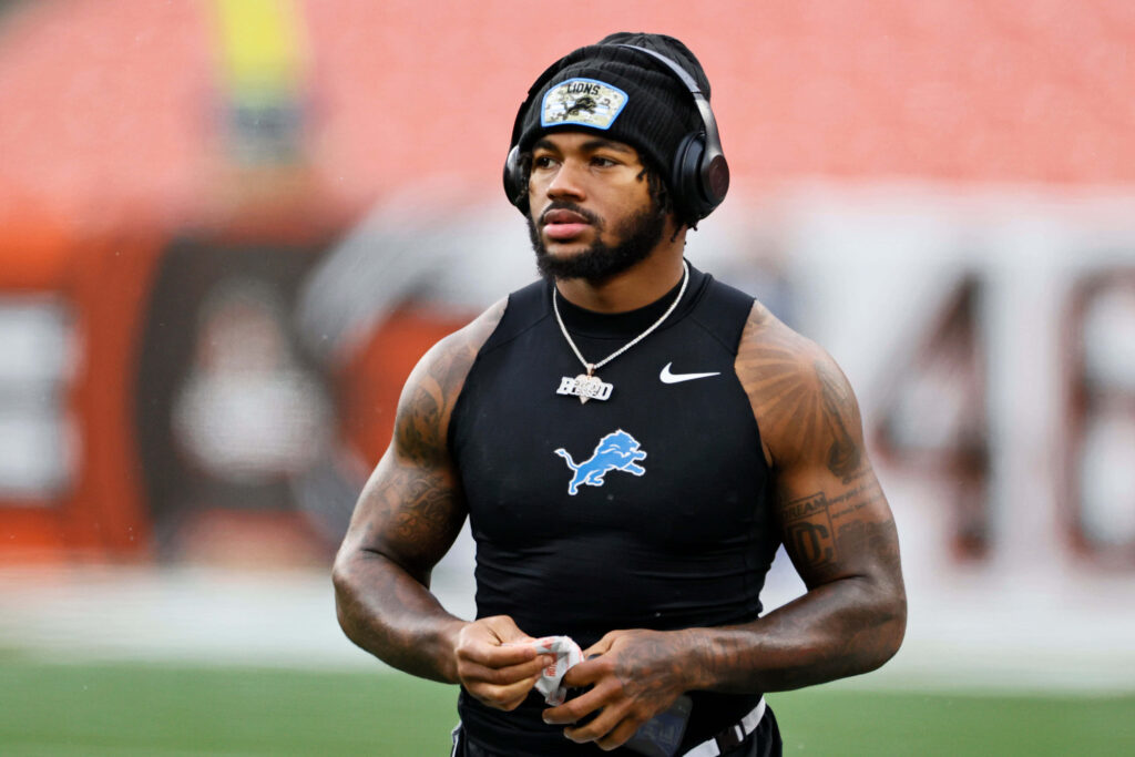 DAndre Swift Detroit Lions warmup focused athlete headphones beanie dynamic sports wallpaper