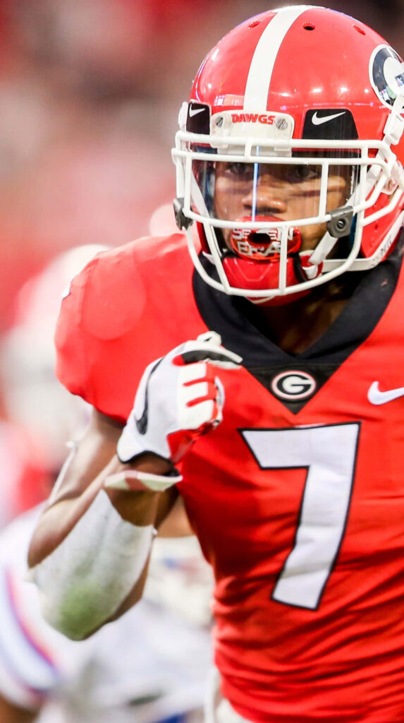 Close-up of D'Andre Swift in Georgia Bulldogs uniform showing intense focus in college football action Wallpaper