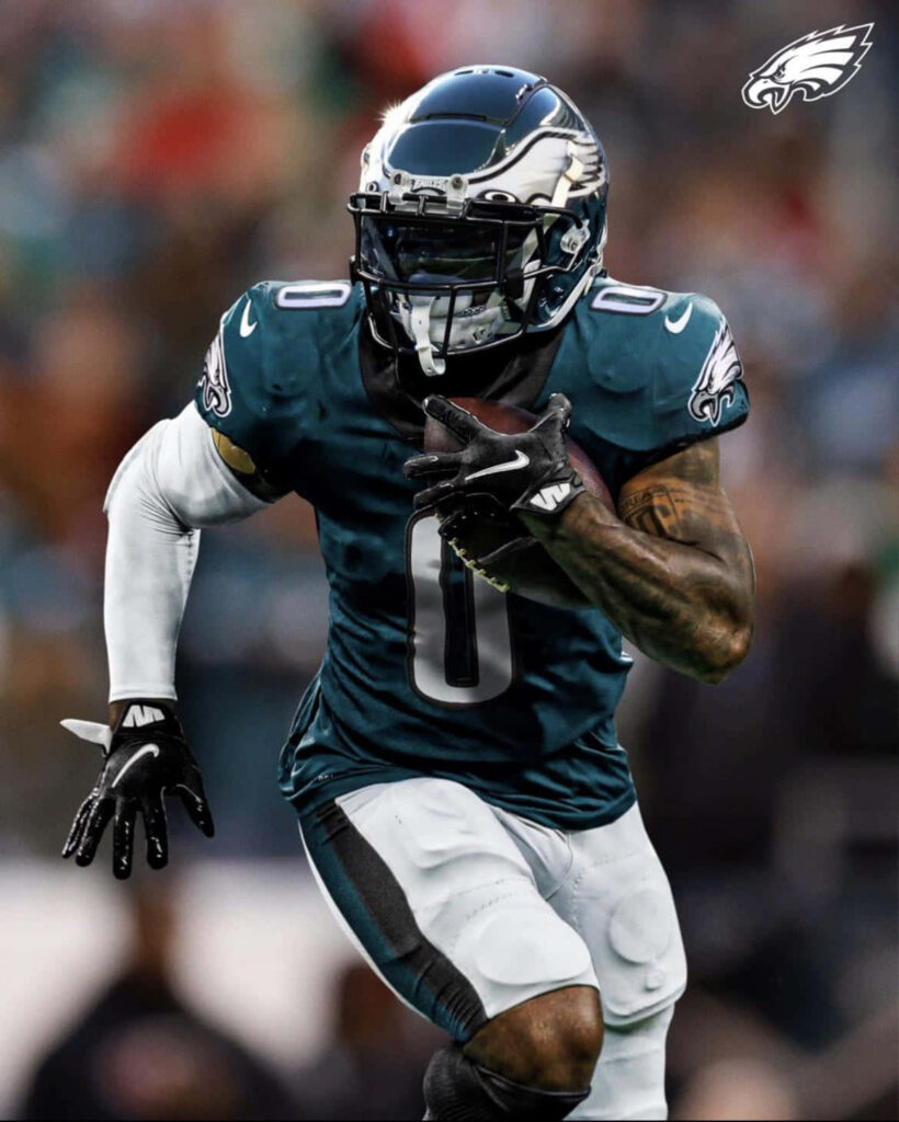 Eagles DAndre Swift sprinting in full uniform on field vibrant green white NFL action wallpaper