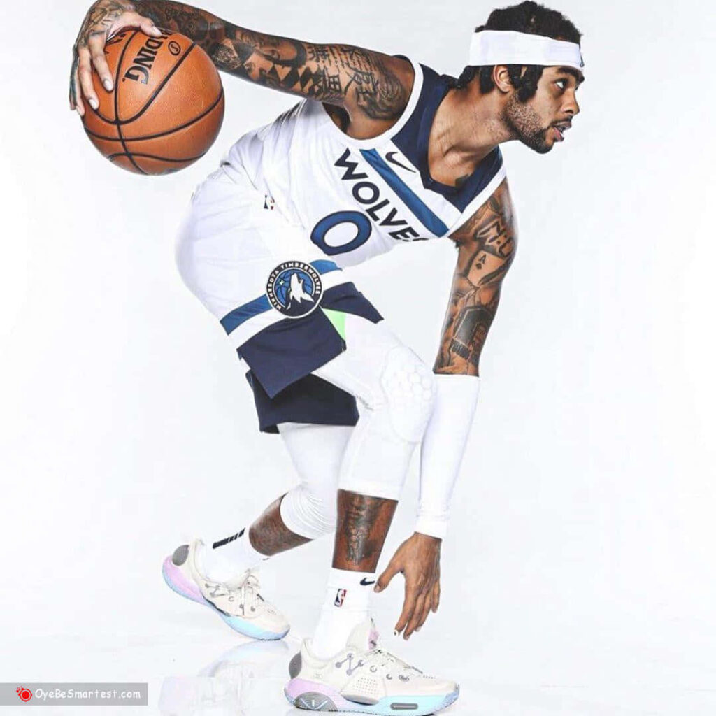 D'Angelo Russell Timberwolves wallpaper mid-dribble detailed tattoos headband white background