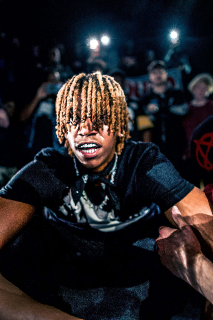 DC The Don live performance wallpaper vibrant stage lighting and energetic crowd background