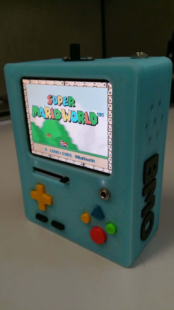 Custom DIY BMO handheld console showing Super Mario World screen with retro controls wallpaper