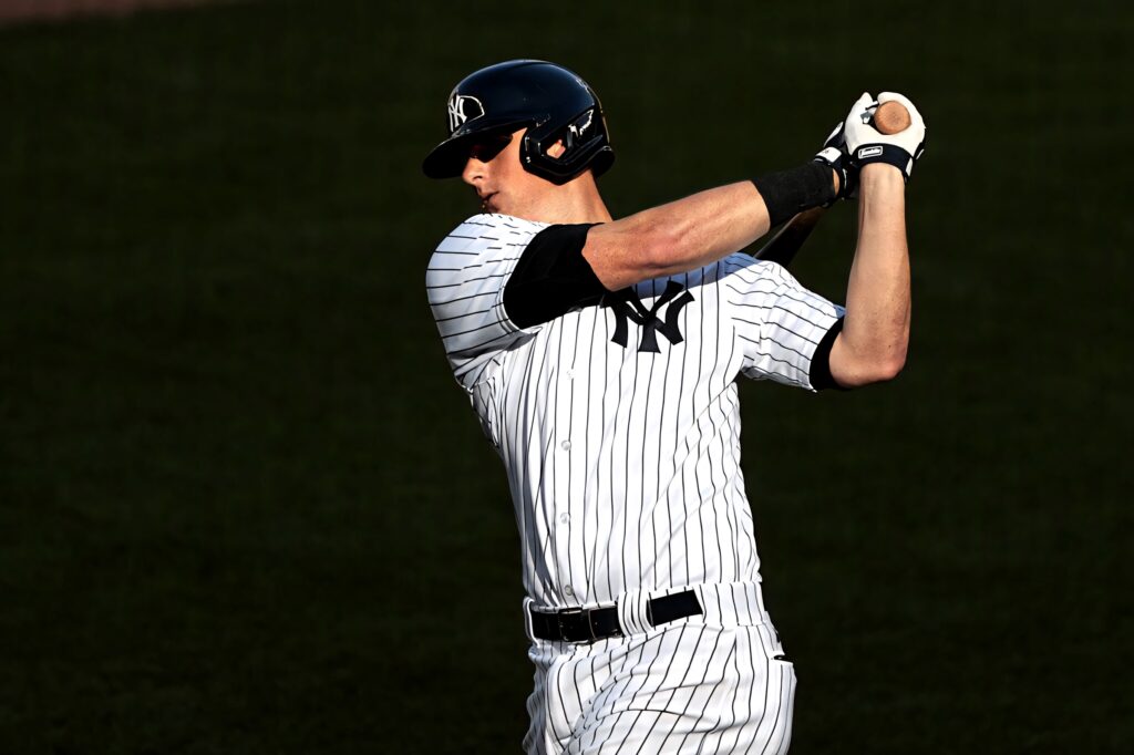 DJ LeMahieu in New York Yankees pinstripe uniform batting stance against black background Wallpaper