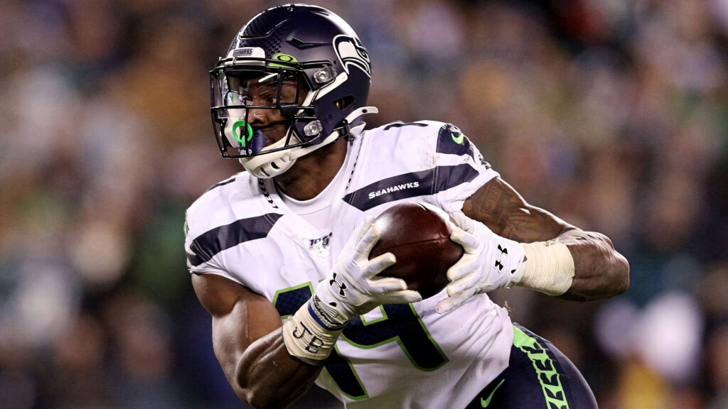 DK Metcalf Seattle Seahawks running with football dynamic action vibrant football wallpaper