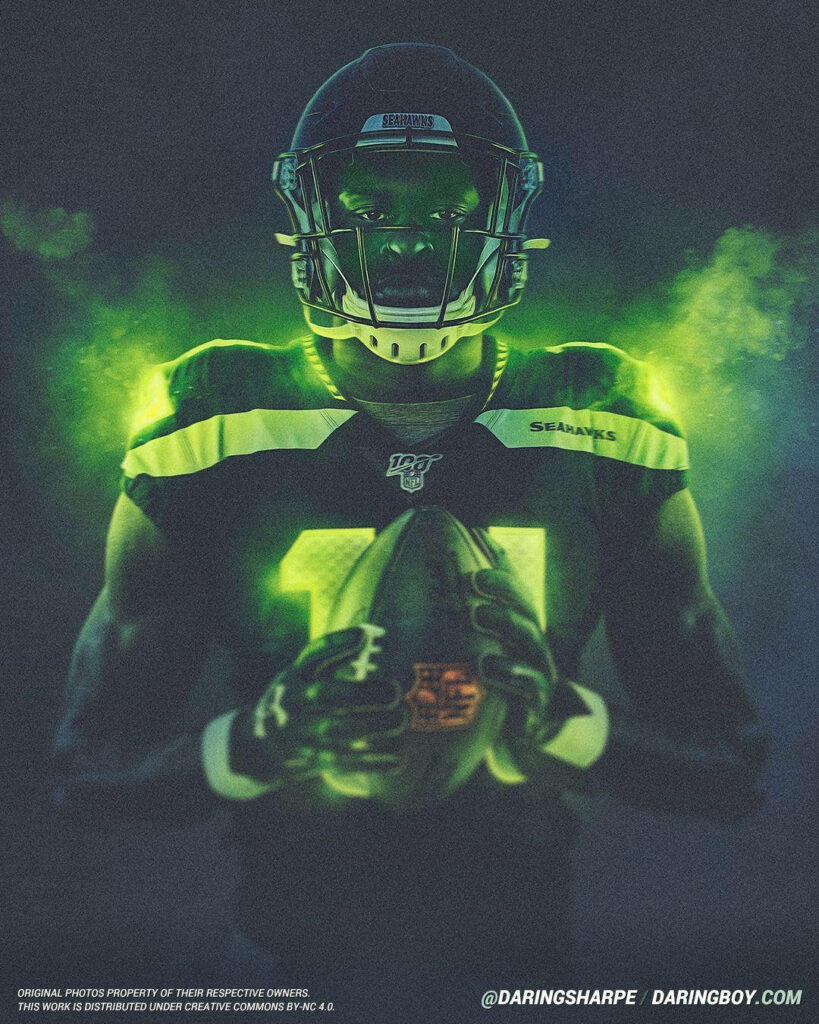 DK Metcalf in Seattle Seahawks uniform with glowing green smoke and intense lighting wallpaper