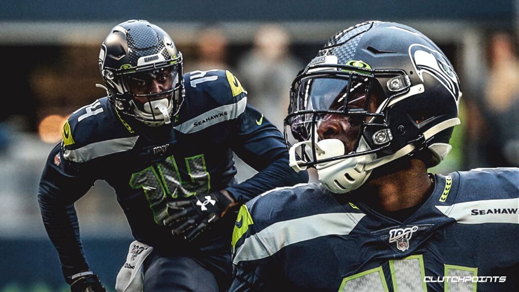 DK Metcalf Seattle Seahawks wide receiver action pose with bold navy neon green uniform wallpaper