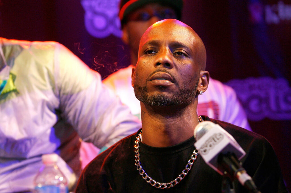 DMX portrait wallpaper intense rapper and actor with chain necklace moody background energy charisma