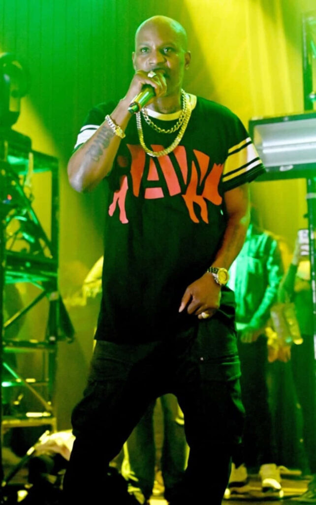 DMX performing live on stage with vibrant yellow green lights gold chains RAW t-shirt wallpaper