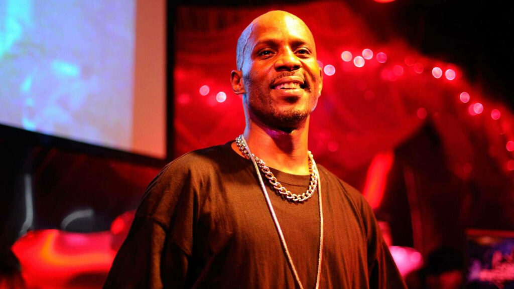 DMX rapper under vivid red lighting wearing signature chain and casual street style wallpaper