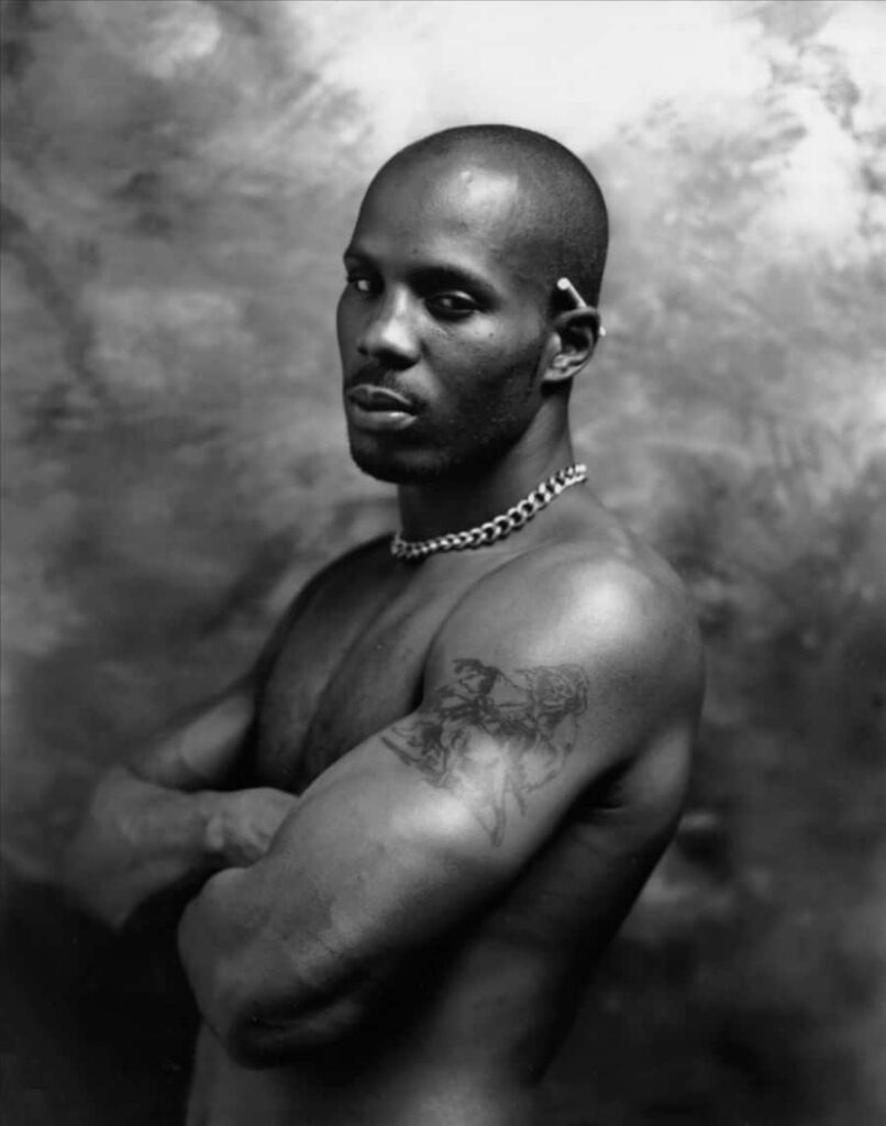 Black and white wallpaper of DMX shirtless showing tattoos chain muscular physique intense look