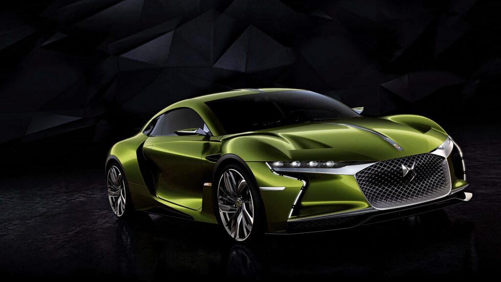 DS Automobiles concept car metallic green futuristic design bold contours dark geometric background Wallpaper