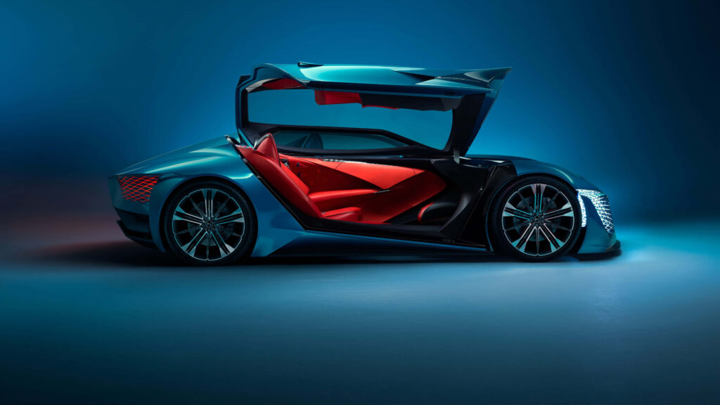 Sleek DS Automobiles concept car with gullwing doors red interior metallic blue futuristic design Wallpaper