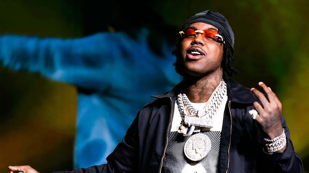 Da Real Gee Money live performance portrait with diamond chains black jacket red shades wallpaper