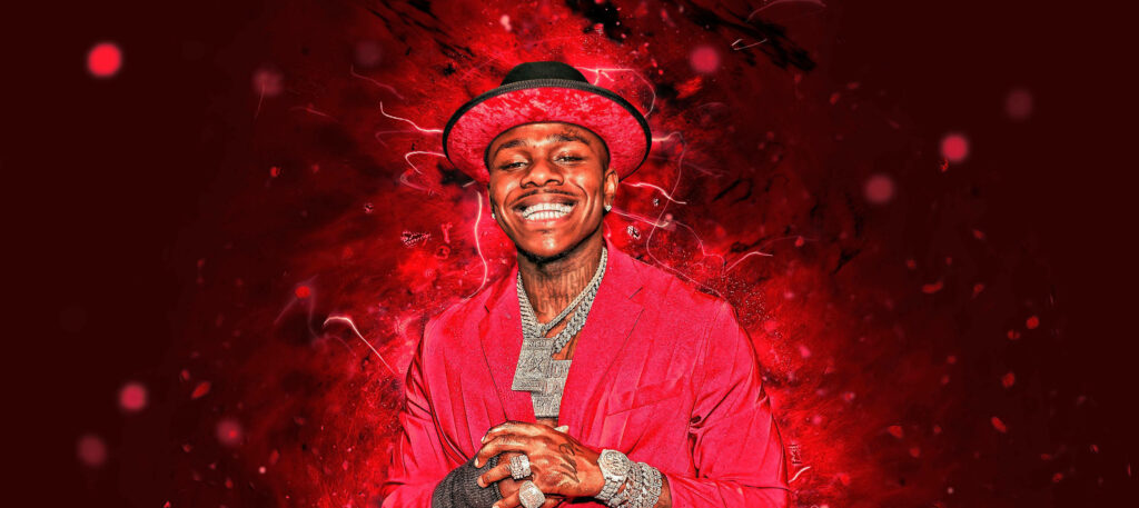 DaBaby in vibrant red suit and hat with electric effects bold red wallpaper background