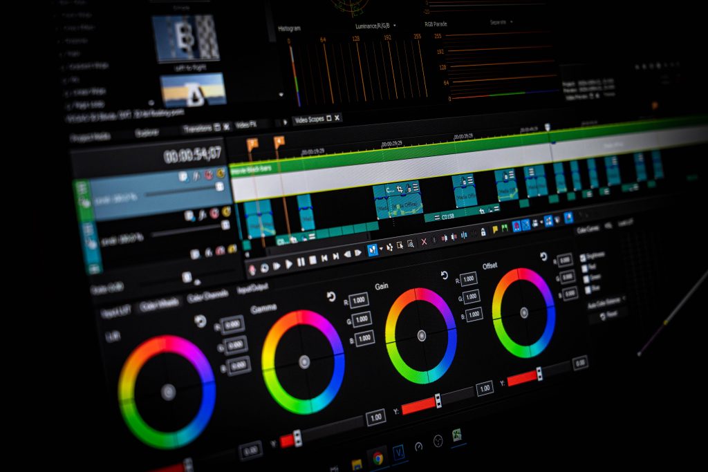 DaVinci Resolve interface wallpaper with color correction tools and video scopes for editors