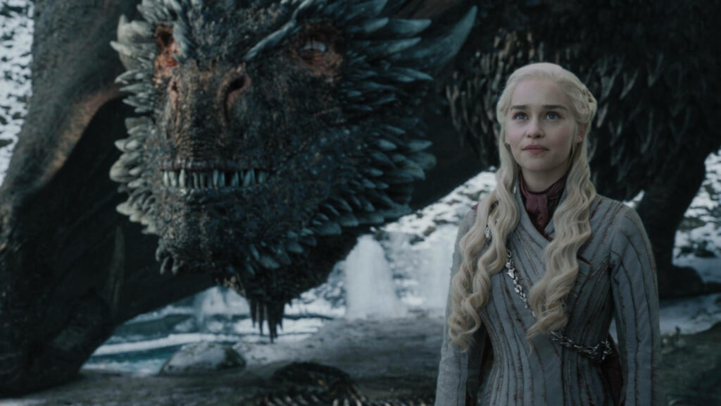 Daenerys Targaryen with dragon Drogon in icy landscape fantasy wallpaper background