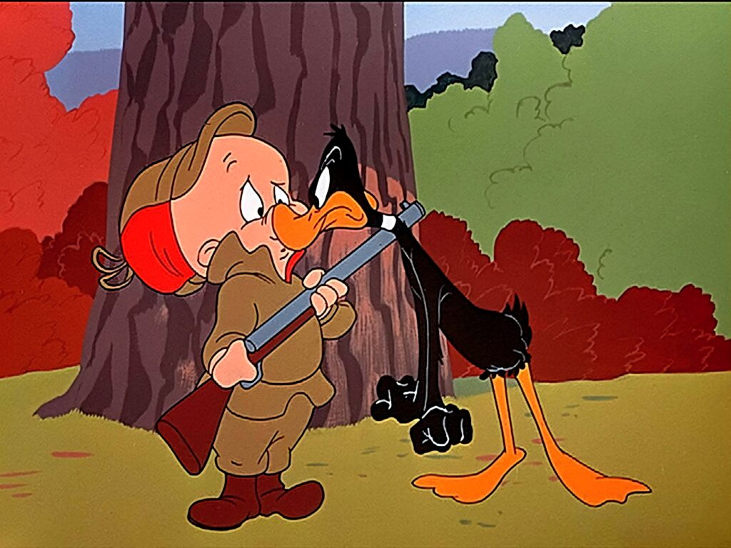 Daffy Duck angrily confronts Elmer Fudd in colorful classic Looney Tunes forest scene wallpaper