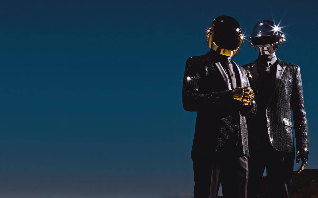 Daft Punk in gold and silver helmets with sequined tuxedos on deep blue gradient background Wallpaper