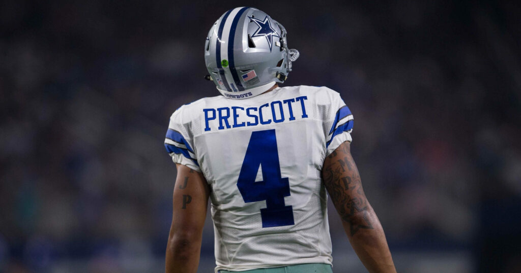 Dak Prescott Dallas Cowboys number 4 back view in stadium lighting football wallpaper background