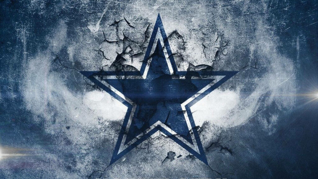 Dallas Cowboys logo on cracked textured background with blue gray white grunge sports design wallpaper