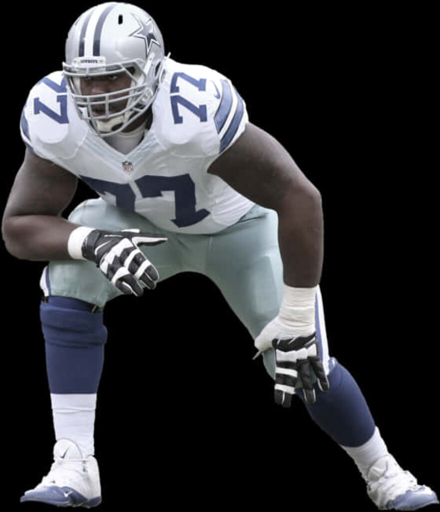 Dallas Cowboys Player in Iconic White & Blue Uniform - Wallpaper