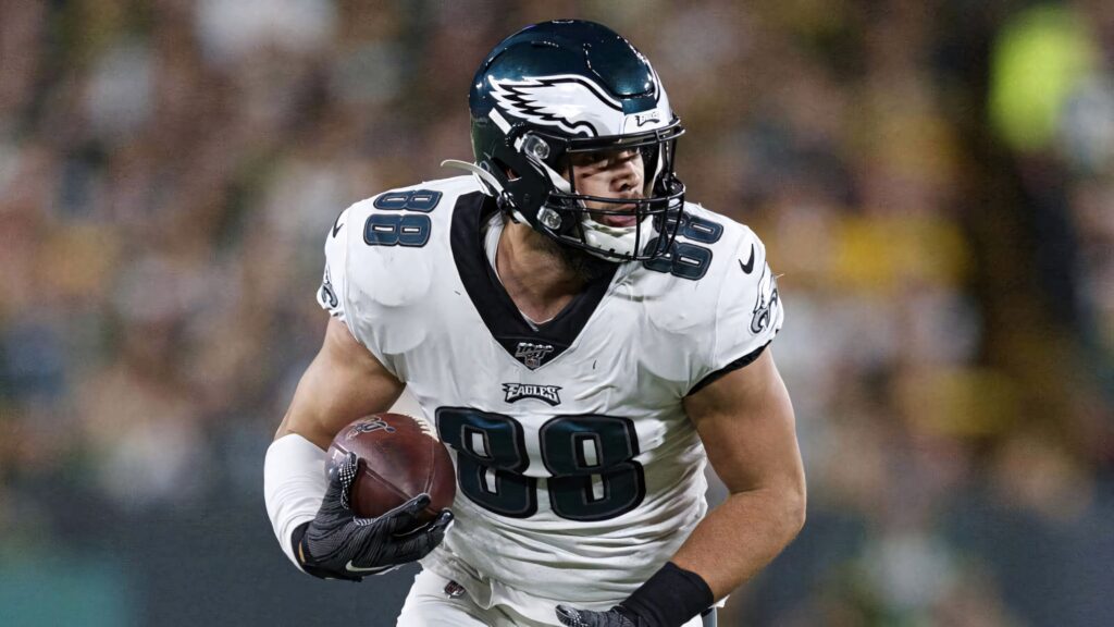 Dallas Goedert Eagles tight end in white green uniform making dynamic play on football field Wallpaper