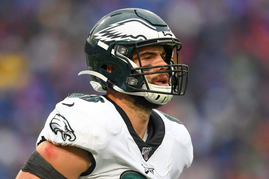 Dallas Goedert Eagles close-up in green white uniform focused during football game action Wallpaper